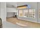 Open-concept living area featuring high ceilings, large windows, and a modern chandelier at 11889 N 113Th Pl, Scottsdale, AZ 85259