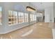 Bright and open living space with large windows and stylish chandelier at 11889 N 113Th Pl, Scottsdale, AZ 85259