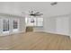 Open living area with glass doors, a ceiling fan, and access to the upper level at 11889 N 113Th Pl, Scottsdale, AZ 85259