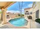 Gorgeous backyard pool with desert landscaping and patio seating, perfect for relaxing and entertaining at 11889 N 113Th Pl, Scottsdale, AZ 85259