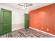 Stylish bedroom featuring sleek plank flooring, and a glimpse into an adjacent room at 12230 W Larkspur Rd, El Mirage, AZ 85335
