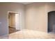 Bedroom hallway features doorway into a bedroom with a closet at 12230 W Larkspur Rd, El Mirage, AZ 85335