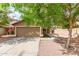 Charming single-story home featuring a well-maintained yard and a two-car garage at 12230 W Larkspur Rd, El Mirage, AZ 85335