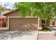 Charming single-story home featuring a well-maintained yard and a two-car garage at 12230 W Larkspur Rd, El Mirage, AZ 85335