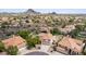 Aerial view of the community showcasing mountain views and neighborhood with desert landscaping at 12853 E Yucca St, Scottsdale, AZ 85259