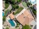 Aerial view showing a pool, putting green and pergola in this well landscaped backyard at 12853 E Yucca St, Scottsdale, AZ 85259