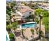 Aerial view of backyard with a pool, covered patio and desert landscaping at 12853 E Yucca St, Scottsdale, AZ 85259