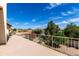 A balcony view overlooking mature landscaping and the mountains in the distance at 12853 E Yucca St, Scottsdale, AZ 85259