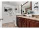 Well-lit bathroom with granite counters, updated fixtures, and a decorative mirror providing a modern touch at 12853 E Yucca St, Scottsdale, AZ 85259
