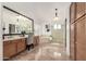 Spacious bathroom with a large mirror, vanity, and a separate shower area, plus lots of storage at 12853 E Yucca St, Scottsdale, AZ 85259