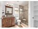 This bathroom features a glass enclosed shower, a vanity with a stone counter, and a toilet at 12853 E Yucca St, Scottsdale, AZ 85259