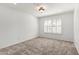 Bright bedroom features neutral carpet, window with shutters and overhead lighting at 12853 E Yucca St, Scottsdale, AZ 85259