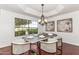 Elegant dining room featuring a modern table, stylish chairs, and a tray ceiling at 12853 E Yucca St, Scottsdale, AZ 85259