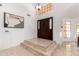 Inviting foyer with marble floors, high ceilings, and an elegant dark wood front door at 12853 E Yucca St, Scottsdale, AZ 85259