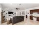 Cozy living room with a built-in entertainment center and a view into the bathroom at 12853 E Yucca St, Scottsdale, AZ 85259
