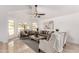 Bright and spacious living room with vaulted ceilings, arched windows, and stylish furniture at 12853 E Yucca St, Scottsdale, AZ 85259