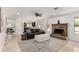 Comfortable living area with a fireplace and an open layout for easy entertaining at 12853 E Yucca St, Scottsdale, AZ 85259