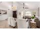 Open-concept living area with high ceilings, chandelier, and seamless flow to other spaces at 12853 E Yucca St, Scottsdale, AZ 85259