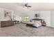 Bright main bedroom featuring neutral colors, a seating area, and large windows offering bright, natural light at 12853 E Yucca St, Scottsdale, AZ 85259
