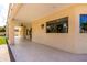 A spacious covered patio with ceiling fan and views of the landscaped backyard at 12853 E Yucca St, Scottsdale, AZ 85259