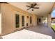 Covered patio area with ceiling fans and tiled floors extends the living space outdoors at 12853 E Yucca St, Scottsdale, AZ 85259