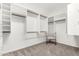 Walk-in closet with custom shelving and storage and natural light at 12853 E Yucca St, Scottsdale, AZ 85259