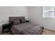 Relaxing bedroom with neutral color scheme, plush bedding and shuttered window at 13228 W Buckskin Trl, Peoria, AZ 85383