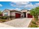 Charming single-story home with a three-car garage and lovely front yard landscaping at 13228 W Buckskin Trl, Peoria, AZ 85383