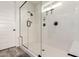 Modern, spacious glass shower featuring black hardware and sleek fixtures at 13228 W Buckskin Trl, Peoria, AZ 85383