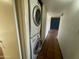 Tiled hallway featuring stacked washer/dryer at 1529 W Eva St, Phoenix, AZ 85021