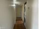 Hallway featuring stacked washer/dryer and tiled floor at 1529 W Eva St, Phoenix, AZ 85021