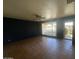 Spacious living room with tiled floor, ceiling fan, and outdoor access at 1529 W Eva St, Phoenix, AZ 85021