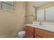 Comfortable bathroom featuring a single sink, vanity, and a mirror at 15420 W Canterbury Dr, Surprise, AZ 85379
