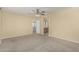 Large bedroom featuring neutral carpet and an en-suite bathroom at 15420 W Canterbury Dr, Surprise, AZ 85379