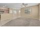 Inviting living room with large windows, neutral colors, and an open layout at 15420 W Canterbury Dr, Surprise, AZ 85379