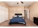 Bedroom with a ceiling fan and large closet doors at 1577 E Earl Dr, Casa Grande, AZ 85122