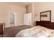 Inviting bedroom with soft carpet and a view into the adjoining bathroom at 1577 E Earl Dr, Casa Grande, AZ 85122