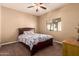 Carpeted bedroom with window, ceiling fan, and a dresser at 1577 E Earl Dr, Casa Grande, AZ 85122
