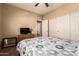Cozy bedroom features neutral walls, patterned bedding, and a closet for ample storage at 1577 E Earl Dr, Casa Grande, AZ 85122