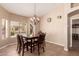 Cozy dining room featuring tiled floors, a chandelier, and natural lighting at 1577 E Earl Dr, Casa Grande, AZ 85122
