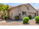 View of charming single-story home showcasing the low-maintenance front yard with desert landscaping at 1577 E Earl Dr, Casa Grande, AZ 85122