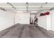 Spacious garage with ample storage, clean floors, and a door to the house at 1577 E Earl Dr, Casa Grande, AZ 85122