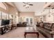 Bright living room with neutral carpeting, plush sofas, an open layout, and large windows at 1577 E Earl Dr, Casa Grande, AZ 85122