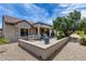 View of back patio with tiled roof and outdoor furniture, perfect for entertaining at 15976 W La Paloma Dr, Surprise, AZ 85374