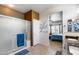 Bright bathroom with a glass-enclosed shower and view into the primary bedroom at 15976 W La Paloma Dr, Surprise, AZ 85374