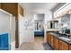 Large bathroom with double sinks, enclosed shower and view into the bedroom and walk-in closet at 15976 W La Paloma Dr, Surprise, AZ 85374