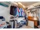 Walk-in closet featuring organized shelving and ample storage for clothing and accessories at 15976 W La Paloma Dr, Surprise, AZ 85374
