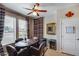 Cozy dining area with wood table, seating for six, and natural light from windows at 15976 W La Paloma Dr, Surprise, AZ 85374