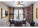 Cozy dining area with seating, unique striped curtains, and a wine cooler at 15976 W La Paloma Dr, Surprise, AZ 85374