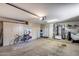 Spacious garage providing ample storage with installed cabinets at 15976 W La Paloma Dr, Surprise, AZ 85374